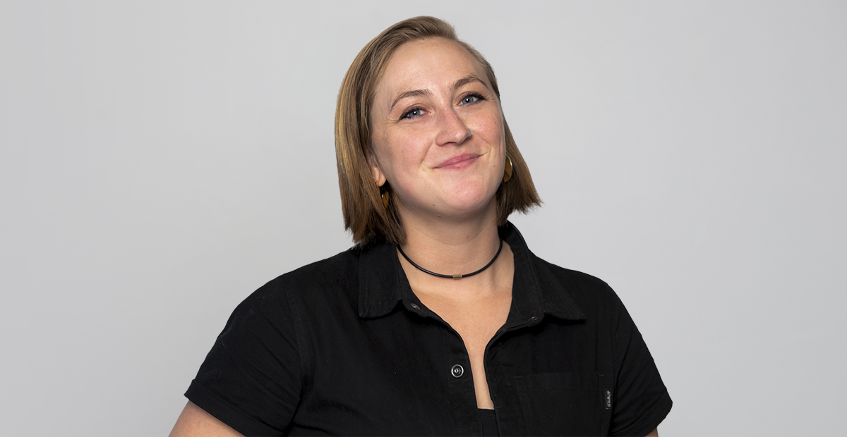 Headshot of women with shoulder length hair in black shirt