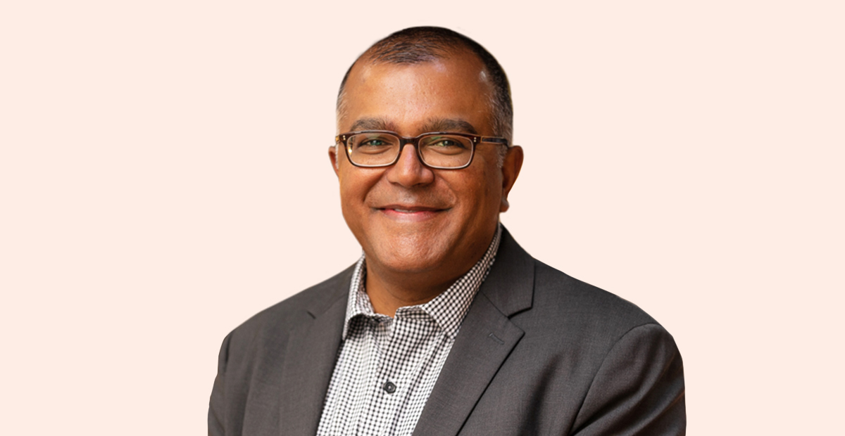 Ravi Moorthy Headshot on neutral backdrop